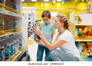 Happy Mother With Her Little Son In Kids Store