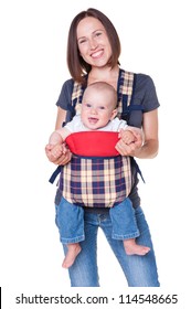 Happy Mother Holding Her Baby In The Knapsack. Isolated On White Background