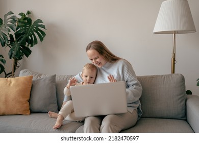 Happy Mother And Kid Waving Hands, While Looking At Web Camera Using Laptop For Video Call, Smiling Mom And Child Having Fun And Greeting Online By Computer Webcam, Making Videocall Via Application 
