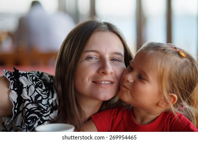 Happy Mother And Little Daughter. Family Photo Closeup. Shallow Depth Of Field. Selective Focus.