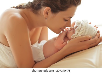 Happy Mother With Newborn Baby