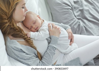 Happy Mother With Newborn Baby