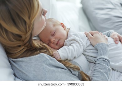 Happy mother with newborn baby