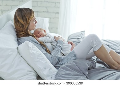 Happy Mother With Newborn Baby