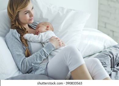 Happy Mother With Newborn Baby