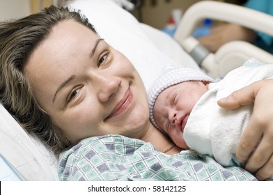 Happy mother with newborn baby