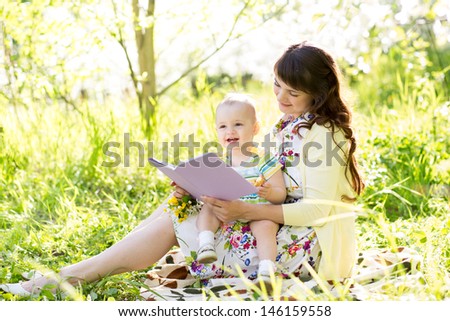 Similar – Reading stories Parenting