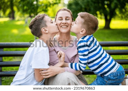 Similar – Image, Stock Photo Little boy kissing his mother on a field in summer