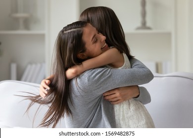 Happy Mother Strong Cuddles Her Little Daughter, Mom Snuggle Kid Girl Showing Unconditional Love And Protection, Miss Each Other Concept Of Single Mother Sole Custody, New Loving Mum For Adopted Child