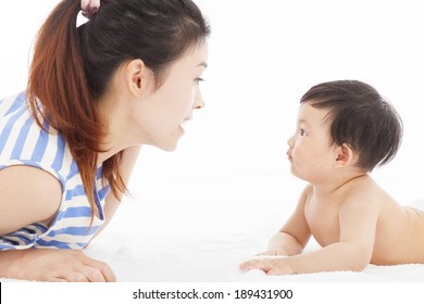 Happy  mother talking with  baby boy