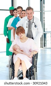 Happy Mother In A Wheelchair With Her Newborn Baby