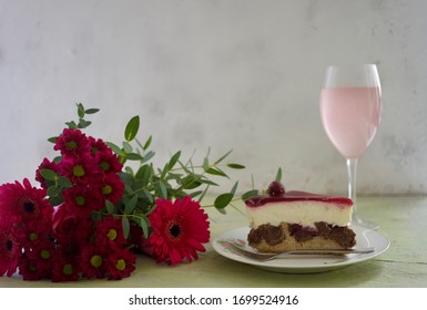 Happy Mother's Day To All Moms Around The World. Pink Flowers, Rose Wine And A Piece Of Red Cherry Cake. Celebrate Motherhood On This Special Day. Space For Copy.