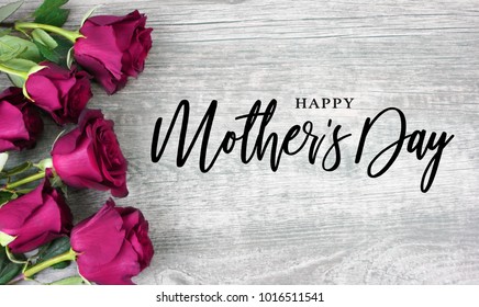 Happy Mother's Day Calligraphy with Pink Roses Over Rustic Wood Background - Shutterstock ID 1016511541