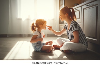 Happy Mother's Day! Child Daughter Congratulates Her Mother And On  Floor In Kitchen Read Postcard
