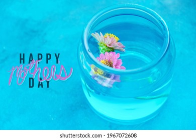 Happy Mothers day colorful and bright background with floating zinnia flwoers.