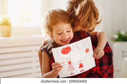 Happy mother's day! Daughter gives her mother an postcard   hugs