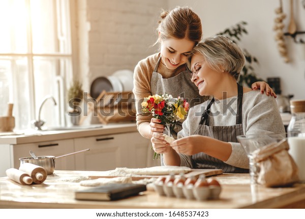happy mother\'s day! family old grandmother\
mother-in-law and daughter-in-law daughter congratulate on the\
holiday, give flowers \
