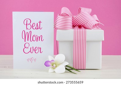 Happy Mothers Day Pink And White Gift With Best Mom Ever Greeting Card, On White Shabby Chic Distressed Wood Table.
