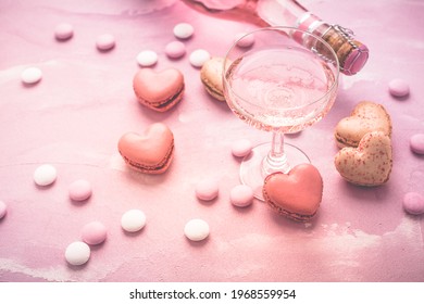 Happy Mothers Day - Sweet Macarons In Heart Shape And Glass Of Rose Sparkling Wine With Flowers In Pink Tone