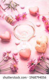 Happy Mothers Day - Sweet Macarons In Heart Shape And Glass Of Rose Sparkling Wine With Flowers In Pink Tone