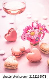 Happy Mothers Day - Sweet Macarons And Glass Of Rose Sparkling Wine With Flowers In Pink Tone