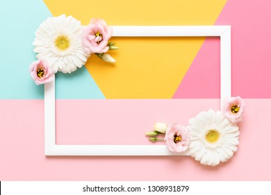 Happy Mother's Day, Women's Day, Valentine's Day or Birthday Pastel Colored Background. Flat lay mock up greeting card with beautiful gerbera flowers.