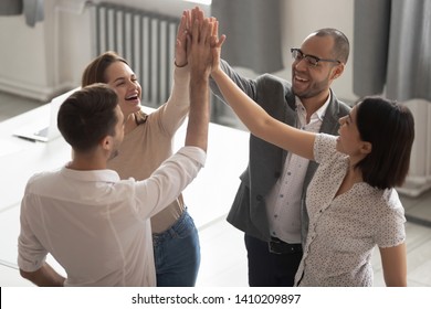 Happy Motivated Diverse Business Work Team People Employees Group Giving High Five Together Engaged In Teambuilding Celebrate Success Good Teamwork Result Shared Win Promise Trust Integrity Concept