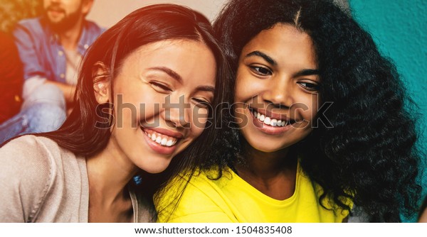 Happy Multi Ethnic Girl Friends Sitting Stock Photo (Edit Now) 1504835408