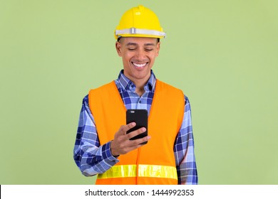 Happy Multi Ethnic Man Construction Worker Using Phone