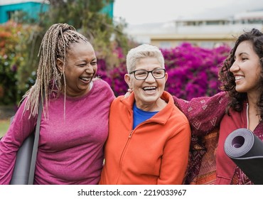 Happy multi generational women having fun together after yoga class at city park - Soft focus on senior african woman face - Powered by Shutterstock