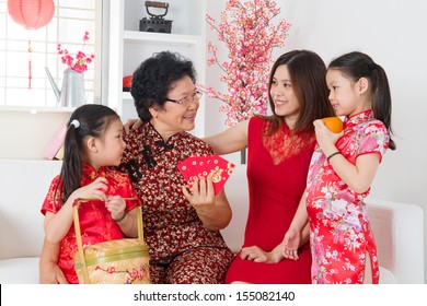 Happy Multi Generations Asian Family Celebrate Chinese New Year At Home.