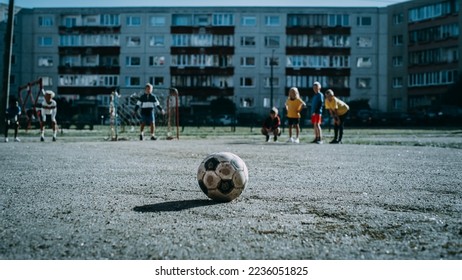 Happy Multicultural Diverse Friends Playing Soccer in Their Backyard on a Sunny Day in Summer. Cheerful Boys and Girls Celebrating Scoring a Goal and Winning the Match. Cold Color Grading. - Powered by Shutterstock