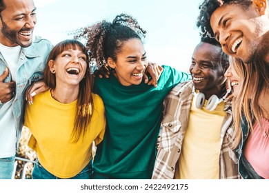 Happy multicultural enjoying summer vacation outdoors - Smiling group of friends having fun walking outside - Friendship concept with guys and girls hanging out on a sunny day  - Powered by Shutterstock