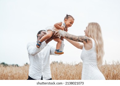 Happy Multicultural Family Of Father Mother And Daughter