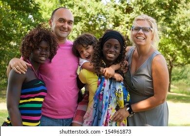 Happy Multicultural Family Having A Nice Summer Day