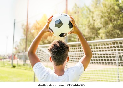 A Happy Multicultural Hispanic Soccer Player Outdoor In Sunny Day