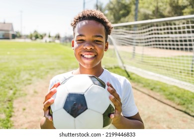 A Happy Multicultural Hispanic Soccer Player Outdoor In Sunny Day