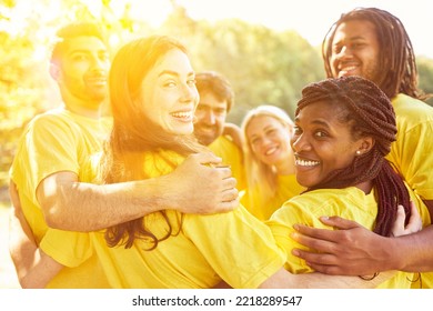 Happy multicultural squad team with hug in circle for motivation