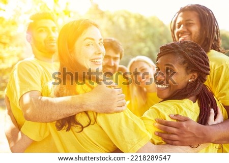 Happy multicultural squad team with hug in circle for motivation