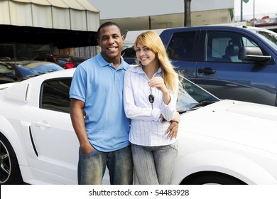 Happy Multiethnic Couple Buying A New Car