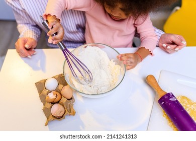 Happy Multiethnic Family Cooking Pastry Together At Kitchen