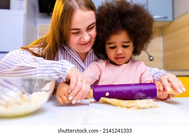 Happy Multiethnic Family Cooking Pastry Together At Kitchen