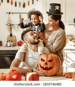 Happy Multiethnic Family Mother, Father And Little Son Have Fun And Celebrate Halloween At Home
