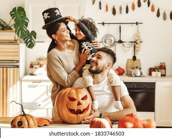 Happy Multiethnic Family Mother, Father And Little Son Have Fun And Celebrate Halloween At Home
