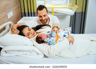 Happy multiethnic family, mother and father wth new born baby boy in post natal hospital department. - Powered by Shutterstock