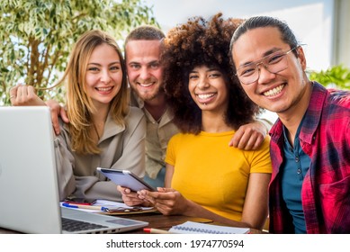 happy multiethnic group of Young people employees workers with laptop in startup studio. Human resource business and teamwork concept on computer. Start up at office brainstorming. working concept - Powered by Shutterstock