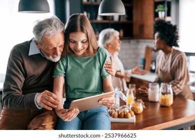 Happy multiethnic multigeneration family with husband, wife, children, grandfather and grandmother - Powered by Shutterstock