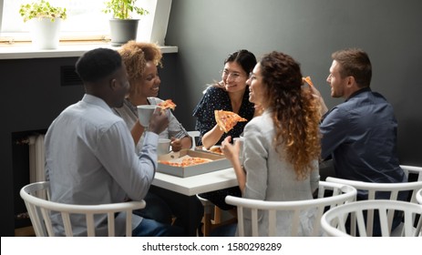 Happy Multiethnic Office Business Team People Having Fun Share Takeaway Pizza Together, Diverse Employees Group Laugh Eat Lunch Dinner Food Meal Talk Enjoy Corporate Party Meeting Sit At Work Table