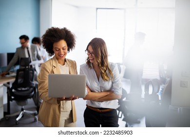Happy multiethnic smiling business women working together in office - Shutterstock ID 2232485903
