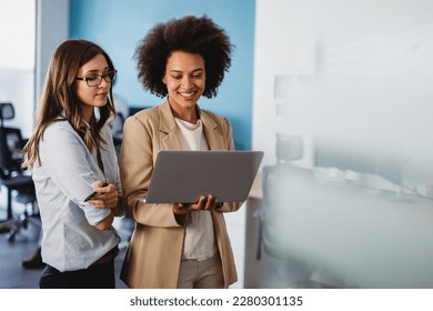Happy multiethnic smiling business women working together in office - Shutterstock ID 2280301135